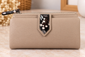 CARTERA MONEDERO BEIGE CON ESTAMPADO FLORAL